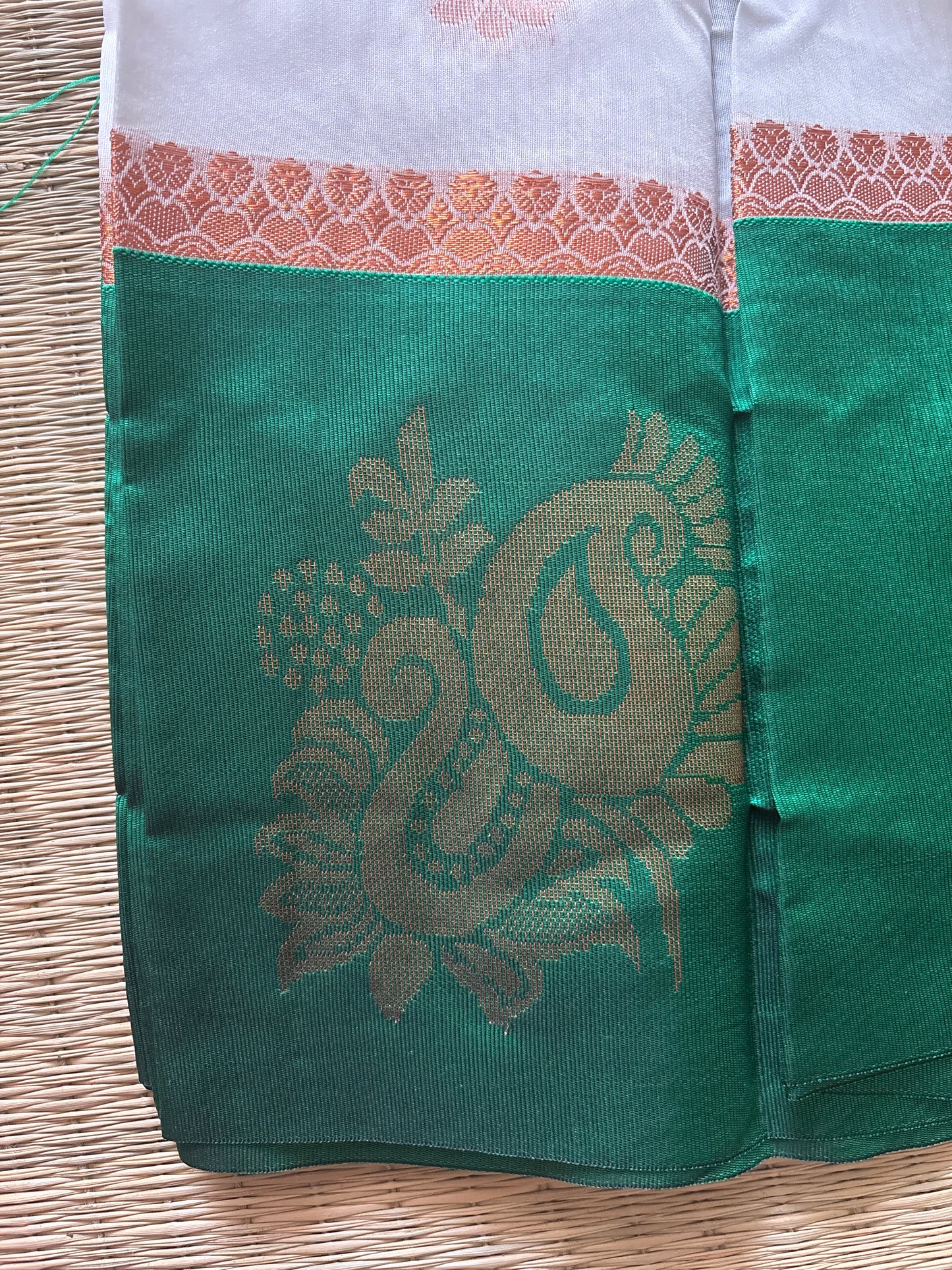 White cotton saree with green border and antique gold motifs